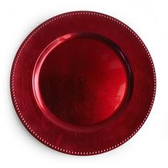 a red plate with beaded edges on a white background