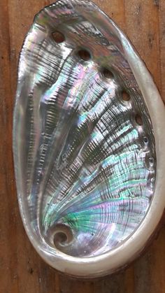 a close up of a sink on a wooden surface