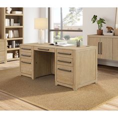 a wooden desk with drawers and a lamp