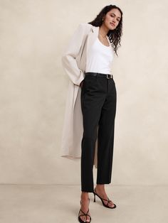 A tailored piece of performance, this soft and luxurious pant is crafted from responsible Italian wool that moves with ease.  A sleek and modern fit for the office or date night.  Stretch, Breathable, Wrinkle-Resistant.  Mid-rise.  Slim leg.  Ankle length.  Fabric from Italy's Marzotto Mill.  Zip fly with button closure.  Four-pocket styling.  Flat front.  Trouser crease.  Unlined.  Slim-Straight Fit: Mid-rise (8").  Straight throughthe hip and thigh, slim leg opening.  Ankle length.  Inseams: Petite/Short 26", Regular 28", Tall 31" Model: Size 2 or 12, 5'10" (178cm). Corporate Chic, Petite Shorts, Satin Blouse, Wool Pants, Slim Leg, Slim Pants, Fashion Studio, Bottom Clothes, Office Outfits