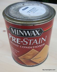 a can of minwax pre - stain wood conditioner sitting on a table