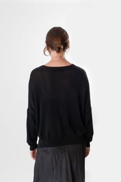 Super soft, relaxed V neck knit in a black pima cotton. Features subtle side slits, long sleeves, and ribbing at neckline and cuffs. Easily layered under coats and styled over our silk slip dresses and our Darby denim pant. Erica Tanov Sizing Erica Tanov Size US Size Chest Sleeve Length 1 2-4 27.5" 14" 23" 2 6-8 28.5" 15.25" 24" 3 10 29.5" 16.75" 26" Details Handmade in Bolivia. 100% cotton. Hand wash cold. Do not bleach. Reshape and dry flat. Erica Tanov, Alpaca Wool Sweater, Bath And Body Shop, V Neck Pullover, Slip Dresses, Silk Camisole, Silk Slip Dress, Linen Shop, Silk Slip