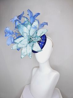 From the 2024 Featured Milliner of the Kentucky Derby Museum  kentucky derby hat fascinator royal blue satin with periwinkle blue feathers and large light blue velvet flower with white pearl decor stretch headband attachment  each hat is totally one of a kind! no two are alike! I can probably add feathers, flowers etc to existing hats for a small fee. I cannot remove anything from existing hats. Just message me and see if we can make it work! :) I cannot make custom order from scratch. My schedu Blue Fascinator With Handmade Flowers For Kentucky Derby, Blue Mini Hats With Handmade Flowers For Royal Ascot, Blue Handmade Flowers Fascinator For Races, Blue Feathered Fascinator For Races, Blue Feathered Fascinator For Kentucky Derby, Blue Feather Fascinator For Races, Blue Feather Fascinator For Kentucky Derby, Blue Feathered Headpieces For Royal Ascot, Blue Feathered Hat For Royal Ascot