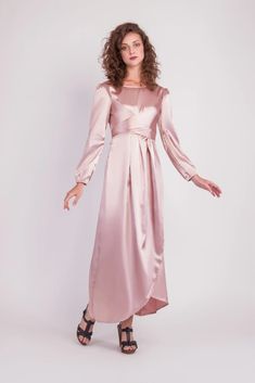 Feel more confident than ever before in the Satin Wrap Maxi Dress with Puff Sleeves that combines modesty with today’s most current modest fashion trends. The sleek satin maxi dress accentuates the waist with a luxurious wrap design while the puff sleeves accent a bold shoulder and feminine shape.Perfect for every special occasion, the unique dress comes in multiple colors to best fit your individual personality. Feminine Belted Maxi Dress, Modest Long Dress For Party, Belted Long Dress For Party, Chic Belted Maxi Dress For Party, Belted Long Party Dress, Chic Party Maxi Dress With Belt, Feminine Belted Maxi Length Dress, Modest Long Party Dress, Spring Party Maxi Belted Dress