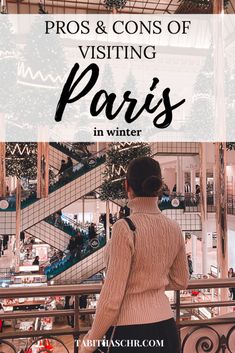 a woman standing in front of a christmas tree with the words pros and cons of visiting paris in winter