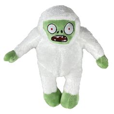 a green and white stuffed animal with big eyes