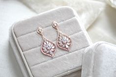 So pretty and sparkly ! These Simple Rose gold Bridal chandelier earrings are dainty and light in weight. Created with Cubic zirconia stones in rose gold, yellow gold or rhodium finish. - Crafted with Premium cubic zirconia stones - All clear stones - Rhodium, yellow gold or rose gold finish- Earrings measure 1.5" x .75"- Nickel free and hypoallergenicThis is an original design by © Treasures by AgnesA perfect gift for a bride or bridesmaid! Glamorous Rose Gold Cubic Zirconia Chandelier Earrings, Rose Gold Cubic Zirconia Dangle Chandelier Earrings, Glamorous Rose Gold Dangle Chandelier Earrings, Glamorous Rose Gold Dangle Bridal Earrings, Rose Gold Dangle Diamond Earrings With Cubic Zirconia, Glamorous Rose Gold Chandelier Earrings, Glamorous Rose Gold Chandelier Earrings As A Gift, Bridal Chandelier Earrings, Camilla Rose