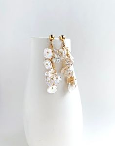 The pearls in this earring remind me of flower petals. Each keshi pearl has a unique shape that lends to the natural shape of petals. This earring is for the romantic at heart.  + Pearls. 14K Gold Fill Post Earring. + Length: 2.75 inch. + Earrings take 1 business day to make. + Your jewelry will come in a jewelry box, tied with a ribbon. ➤➤ Have a question about this product, reach out to me here ➙ https://www.etsy.com/conversations/new?with_id=9057464&referring_id=5772224&referring_type=shop&re Elegant Gold Flower Earrings With Dangling Beads, Wedding Earrings With Pearl Charm And Mother Of Pearl, Wedding Mother Of Pearl Earrings With Pearl Charm, Party Pearl Drop Earrings Made Of Mother Of Pearl, Elegant Flower-shaped Earrings With Dangling Beads, Wedding Pearl Drop Earrings In Mother Of Pearl, Elegant Mother Of Pearl Flower Earrings For Weddings, Elegant Flower Earrings With Dangling Beads, Teardrop Mother Of Pearl Wedding Earrings