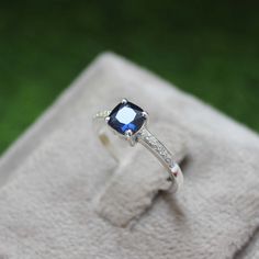 * Material: 925 Sterling Silver * DETAILS ✥ Handmade Ring ✥ - Center Stone: Lab Blue Sapphire  - Center Stone Size: 6 MM - Center Stone Shape: Cushion  - Side Stone: CZ Diamond  ✥ O T H E R ∙ I N F O R M A T I ON ✥ ♦ Your item will be nicely packed to gift in elegant jewelry boxes. ♦ Custom Order We can make custom rings in almost any shape and style. If you want a specific model, please send us a clear picture and we will do our best. ♦ Delivery All Item will be Shipped within 3 to 5 Days after Blue Princess Cut Sterling Silver Jewelry, Classic Sapphire Birthstone Ring In Sterling Silver, Silver Sapphire Ring In Princess Cut, Sapphire Jewelry With Princess Cut Center Stone, Princess Cut Lab-created Sapphire Jewelry As Gift, Princess Cut Sapphire Ring In Sterling Silver, Princess Cut Lab-created Sapphire Jewelry For Gift, White Gold Sapphire Ring As A Gift, Silver Sapphire Princess Cut Ring For Gift