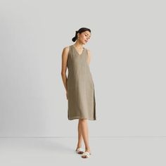 Introducing our ' V-Neck Straight Dress' - an epitome of effortless elegance and minimalist chic. This midi-dress embodies modern sophistication with its clean lines and contemporary cut, embracing the essence of simplicity. Designed for versatility, it's a summer essential, perfect for various occasions. Its A-line fit offers comfort and style, while the V-neck and in-cut sleeves add a touch of allure. This stylish dress is complemented by functional pockets on both sides for practicality. Wash Modern V-neck Dresses For Daywear, Elegant Linen V-neck Dress, Elegant V-neck Linen Midi Dress, Chic Linen Midi-length V-neck Dress, Chic Linen Midi V-neck Dress, Elegant Linen Midi Dress With V-neck, Summer Neutral V-neck Midi Dress, Chic V-neck Linen Dress For Daywear, Neutral V-neck Midi Dress For Summer