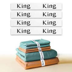 four folded sheets with the words king, king, and queen printed on each sheet