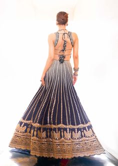 Editor's Note Captivate in the allure of heritage embroidery with this stunning lehenga, adorned in exquisite marodi and gota work, showcases vertical floral lines converging at the waist for a... Gopi Vaid, Gota Embroidery, Cancan Lehenga, Bohemian Jewels, Lehenga Pattern, Black Lehenga, Work Lehenga, Gota Work, Backless Blouse