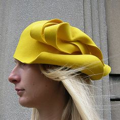 High quality felt hat made from 100% natural wool fabric.  An asymmetric pattern in colors and design according to preference.  Appropriate for casualwear, weddings, parties, or funeral.  It can be worn as you please:  sideways or backward. Fitted Wool Cloche Hat, Modern Fitted Hats For Spring, Fitted Wool Party Hat, Fitted Wool Cloche Hat With Curved Brim, Adjustable Wool Party Hats, Wool Brimmed Hat For Party, Fitted Wool Felt Hat For Kentucky Derby, Wool Party Hat With Short Brim, Wool Brimmed Party Hat