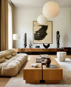 a living room filled with furniture and art