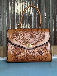 Medium handbag from the 1970's. Brand new. Hand Tooled Brown Handheld Shoulder Bag, Brown Hand Tooled Shoulder Bag, Luxury Vintage Hand Tooled Bag, Brown Retro Shoulder Bag With Hand Tooled Details, Vintage Brown Hand Tooled Bag, Tooled Leather Bag, Western Purses, Medium Handbags, Leather Ideas