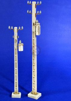 two tall wooden poles with electrical wires attached to them and the price is $ 54 95