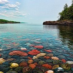 the water is crystal clear and has rocks in it