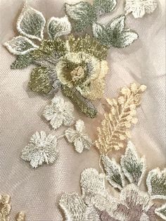 "This embroidered tulle is gorgeous! The rose design is embroidered in ivory and pale lilac. The leaves are ivory and sage green. The lilies are pale beige/ cream. Some of the roses are also pale beige/ cream with metallic gold. The tulle is a pale grayish-beige. This fabric is not scalloped on the edges. The design runs from selvedge to selvedge. I personally feels it's better for appliquéing. In the photos it is lined with a gold chiffon. Sold by the panel- this includes 3 full rows of design- Cotton Dress Fabric, Pale Beige, Pale Lilac, Bead Embroidery Patterns, Embroidered Tulle, Boutique Dress Designs, My Sewing Room, 자수 디자인, Fabric Beads