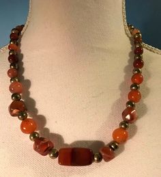 "Necklace measures 20\" 8 mm and 10 mm rounds. Focal bead is 1 inch long." Vintage Adjustable Carnelian Necklace, Vintage Orange Agate Necklaces, Vintage Red Agate Necklace, Sky Blue Dress, 20 Inch Necklace, Orange Carnelian, Red Agate, Red Jasper, Beaded Necklaces