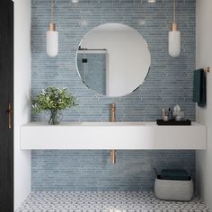 a white sink sitting under a mirror in a bathroom next to a wall mounted faucet