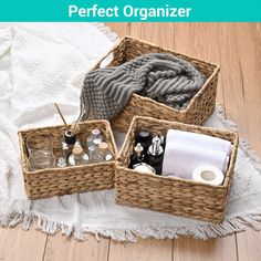 three wicker baskets filled with personal care items on a white towel and wooden floor