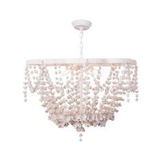 a white chandelier with shells hanging from it's center beam and two lights on each side