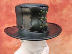 Dark Green Leather Corset Top Hat, Leather hat, Halloween, Fairy, Woodland, Festival, cosplay, tree hat, Steampunk, troll, LARP Vegetable tanned leather. Cute hat for woodland witch, Halloween-party and other Size: XS-S || 55 cm || 21.6 inch M || 57 cm || 22.4 inch L || 59 cm || 23.2 inch XL || 61 cm || 24 inch *Made with genuine cowhide leather *Custom made to order *If interested in a specific color please specify when you order *Extremely comfortable *Durable and water resistant Adjustable Steampunk Costume Accessories For Fantasy Events, Steampunk Top Hat For Halloween Cosplay, Fitted High Crown Top Hat For Cosplay, Themed High Crown Costume Hats For Cosplay, Steampunk High Crown Top Hat For Cosplay, Gothic High Crown Top Hat For Themed Events, High Crown Costume Hats For Halloween Cosplay, High Crown Costume Hats For Cosplay Halloween, High Crown Cosplay Hat