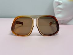 Super Rare! Vintage 70s PIZ BUIN Sunglasses. These are Super fly! Loving the ombre frames - toffee, caramel and orange coloured. The shape of those arms! Super sized.  * Era: 1970s * Style: Oversized Unisex - Carrera Style * Colour: Ombre - Orange, toffee, amber, caramel brown  * Lens Colour: Amber/ Grey  * Condition. Very good vintage . No scratches on the lens Measurements are on the last pic. Length of the arm is approx 12.5cm Vintage Brown Shield Sunglasses With Gradient Lenses, Retro Brown Shield Sunglasses With Mirrored Lenses, Shades Glasses, Wild Iris, Lens Colour, Super Fly, 1970s Style, Brown Lens, Stylish Glasses