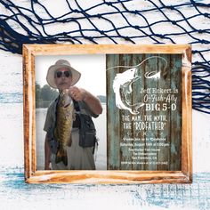 a man holding a fish in front of a fishing net with his birthday card on it