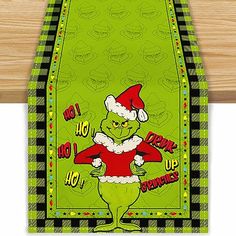 the grinch christmas towel is hanging on a wall