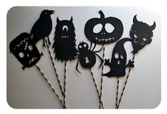 a group of halloween decorations on sticks