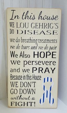 a wooden sign that says in this house we love gerige's disease