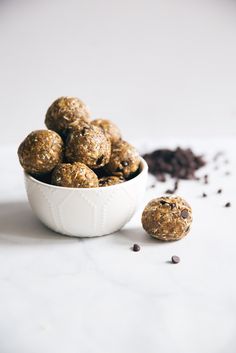 a white bowl filled with chocolate chip energy bites