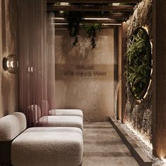 the interior of a spa with stone walls and benches