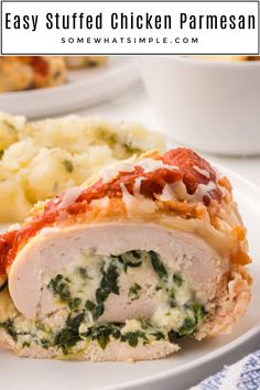 an easy stuffed chicken parmesan on a plate with mashed potatoes and spinach