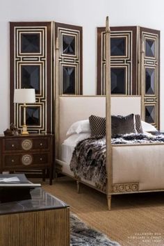 a bedroom with a bed, dresser and mirror on the wall next to each other