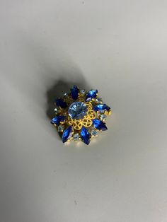 French vintage lapel pin brooch jewelry                     ref no 195 diameter 1.15in or 3cm open and shut well great design and colors light bleue and center dark blue stones If you buy more than one item contact me for a discount Free shipping within USA See my other items for sale on Etsy https://www.etsy.com/shop/annickantiques Thank you for looking Annick Make sure to double check the measurements Vintage Blue Brooches For Jewelry Making, Blue Costume Jewelry Brooch For Wedding, Blue Vintage Brooch For Party, Vintage Blue Brooch Pin, Blue Brooch Lapel Pin As Gift, Blue Brooch Pin As Gift, Blue Brooch Pin For Gift, Blue Brooch Pins For Gift, Blue Brooch Pins As A Gift