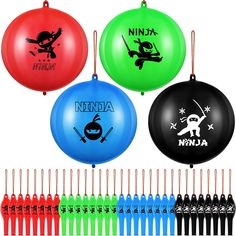 four different colored frisbees with ninja designs on them and one is black