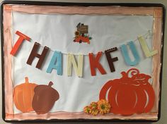 a bulletin board with the words thank you and pumpkins on it, hanging from clothes pins