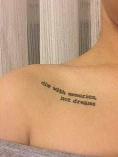 a woman with a tattoo on her shoulder that says, die with memories not dreams