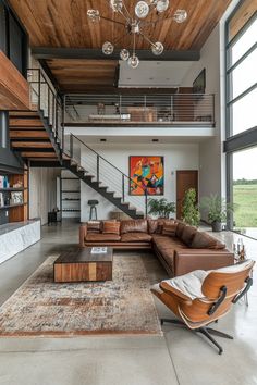 a living room with couches, chairs and a stair case in the middle of it