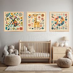 a baby's room with three paintings on the wall