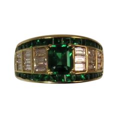 Picchiotti 18K yellow gold ring set in center with one square emerald cut emerald weighing .89cts, surrounded by 34 square emeralds weighing 1.07cts and 22 baguette diamonds weighing 1.20cts, F-G color, VS clarity. Finger size 6.5, may be sized Green Square Cut Diamond Ring Fine Jewelry, Fine Jewelry Green Diamond Ring With Square Cut, Square Cut Green Diamond Ring In Fine Jewelry Style, Luxury Green Asscher Cut Emerald Ring, Luxury Yellow Gold Emerald Ring With Square Cut, Luxury Asscher Cut Green Emerald Ring, Classic Green Diamond Ring With Baguette Diamonds, Classic Green Rectangular Diamond Ring, Classic Green Emerald Ring With Baguette Diamonds