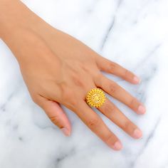 This 22k gold statement ring features a brilliant decadent design, perfect for adding elegance to any outfit. Weighing 5.9 grams, it showcases a yellow gold finish that enhances its luxurious and intricate appearance. Sized at 5.75, with adjustable sizing from 4.75 to 6.75, and a ring diameter of 0.9 inches, this ring combines style and practicality, making it ideal for special occasions or everyday wear. Suitable for those who appreciate opulent and refined jewelry, this ring brings a touch of brilliance and decadence to your collection. PRODUCT DETAILS Gold Purity(karat): 22k Gold Weight(grams): 5.9 Item Finish: Yellow Gold Ring Size: 5.75 Ring Diameter: 0.9" Adjustable Ring: Yes, Size 4.75 - 6.75 Luxury 22k Gold Round Ring, Gold Plated Yellow Gold Flower Ring, Gold-plated Yellow Gold Flower Ring, Fine Jewelry 22k Gold Ring For Formal Occasions, Formal 22k Gold Rings Fine Jewelry, Gold Plated Dome Ring For Wedding, Gold Open Ring Filigree For Formal Occasions, Gold Open Filigree Ring For Formal Occasions, Wedding Gold Plated Dome Ring