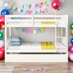 a white bunk bed with balloons and streamers