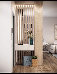 a living room filled with furniture next to a white wall and wooden slatted walls