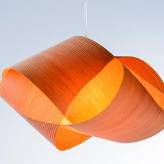 an orange lamp hanging from the ceiling