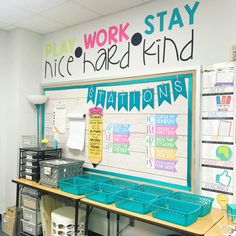 a classroom with desks and writing on the wall