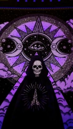 a person standing in front of a purple background with an all seeing skull on it