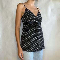 Vintage Black White Sparkle Polka Dot Babydoll Type Tank Top Size large modeled on size small Mint condition This item is one of a kind, so you will receive this exact item! It will be shipped in one to two days. Check our reviews about fast shipping and quality items!  We are a sustainable, curated and custom shop called AKIND - bringing new trends to one of a kind thrifted and vintage! We treat each order with care and are appreciative for each one. Please don't hesitate to contact us with questions about sizing or other; we respond quickly! We currently don't accept returns/exchanges due to the difficulty, delayed times, and expensiveness of shipping during a pandemic. Thank you for understanding! 90s Minimalism Fashion, Y2k 90s Aesthetic, Top With Bow, Floral Cami, 90s Aesthetic, Aesthetic Clothing, Black Sparkle, Y2k 90s, Cami Tanks